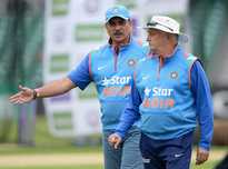 Director of Cricket Ravi Shastri speaks with coach Duncan Fletcher during a nets session.